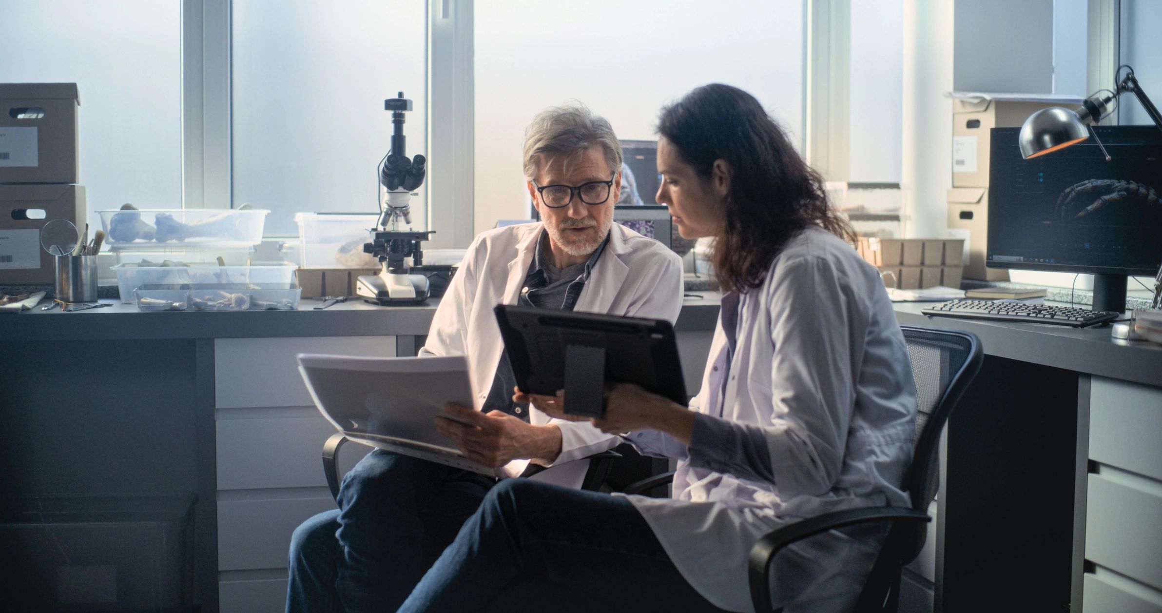 Two scientists reviewing research and business plans together